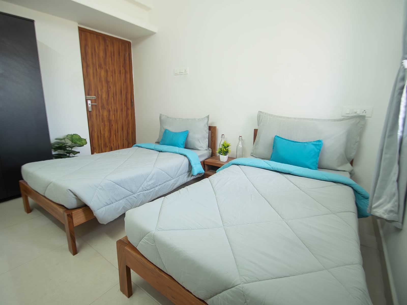 Furnished twin-sharing room at Zolo Dreamtown
