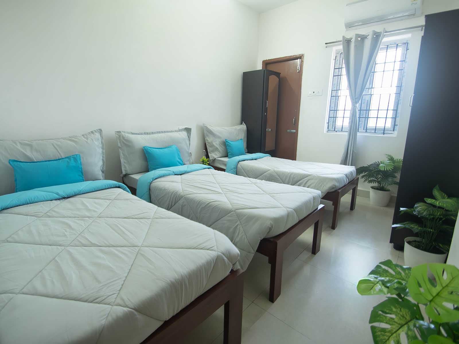 Furnished triple-sharing room at Zolo Dreamtown